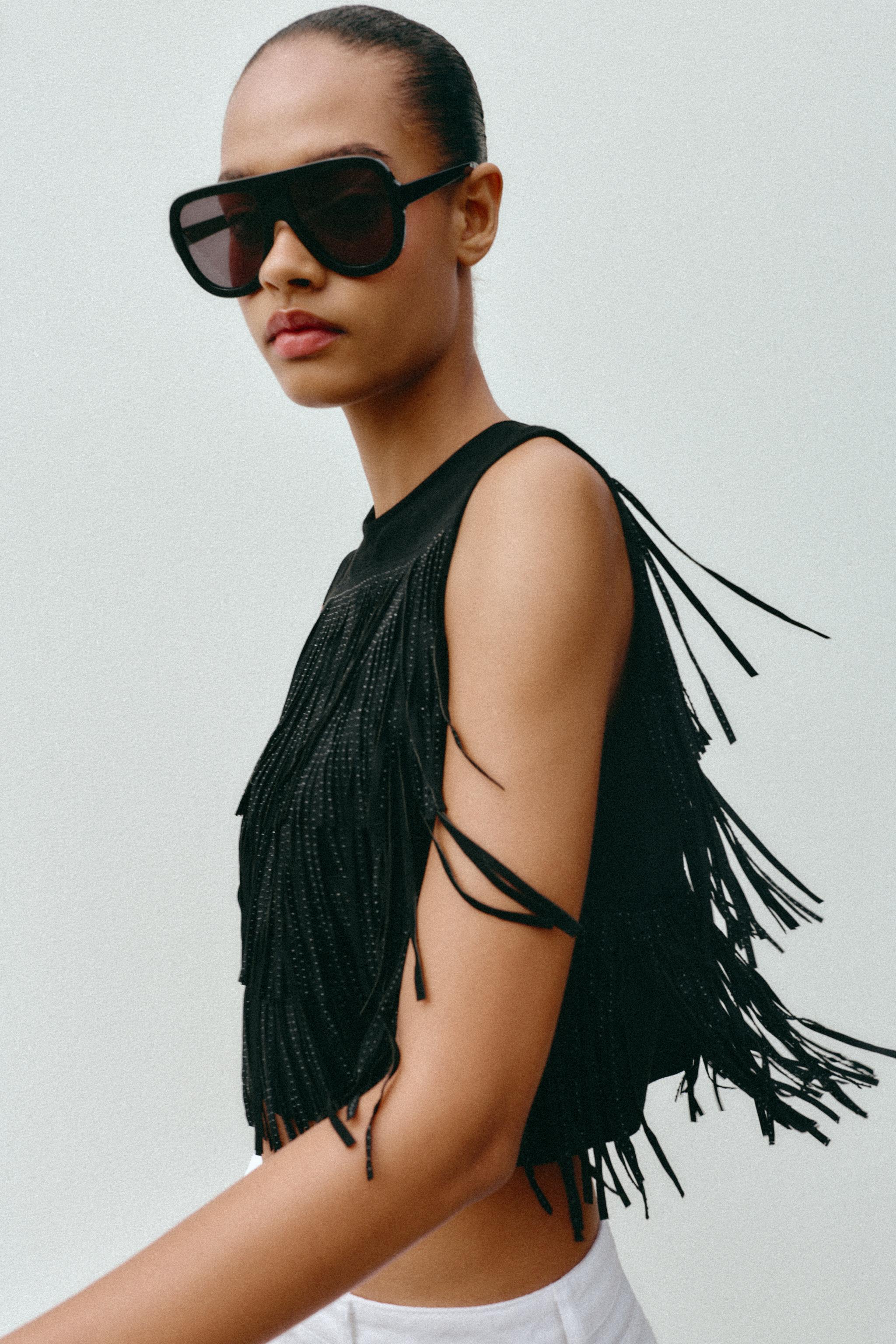 STUDDED FAUX SUEDE FRINGE TOP